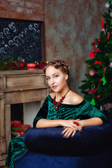 Obraz na płótnie Canvas portrait of a young woman near the Christmas tree