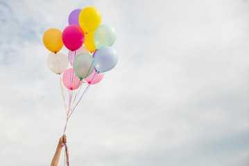 Let it go, Freedom hand and Release concept. Birthday balloon Holding by Happy Beautiful women in...