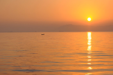 A Boat in the Morning Sea