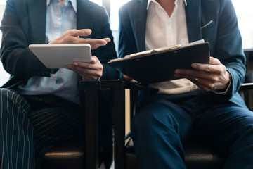 business people and coworker colleagues discussing explanations about week working plan project cooperating in modern coworking office.