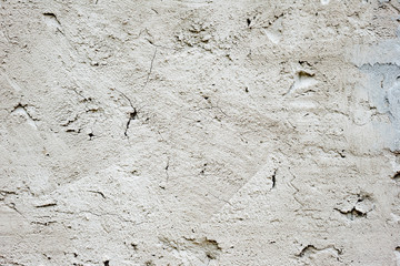 Texture of a concrete wall with cracks and scratches which can be used as a background