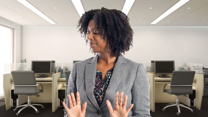 Black African American businesswoman in an office looking disgusted.  She is an owner or an...