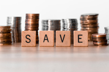 Save signs with coins in the background