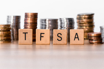 TFSA (Tax Free Saving Accounts) signs with coins in the background