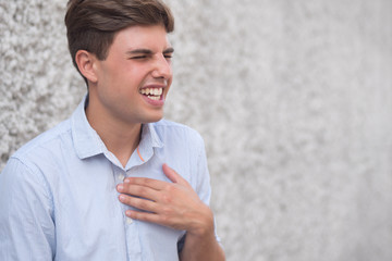 sick man suffering from stomachache, heart burn, acid reflux, GER Disease or GERD