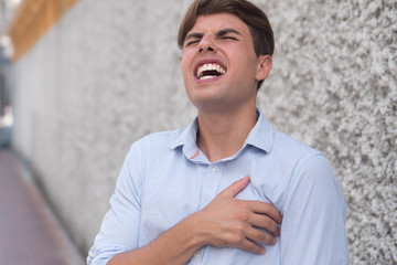 man suffering from heart attack