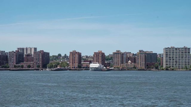 STATIC TIME LAPSE: Daytime New York City time lapse from Manhattan looking across the Hudson River to Hoboken NJ at the ferry before it sets out.