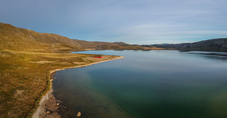 Golden morning light, Lake Amitsorsuaq  and the Canoe Centre Hut on the Arctic Circle Trail in Greenland.