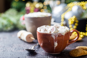 hot cocoa with marshmallows, cream and cookies on holiday christmas background
