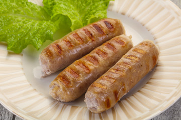 Grilled sausages served mushrooms and cabbage