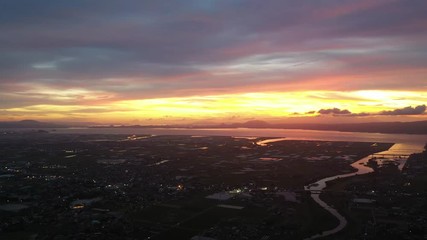 Shot from the sky at dusk in the countryside of Japan