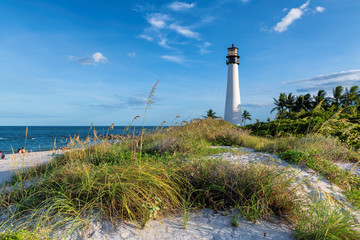 Florida beach with lighthouse. Cape Florida Lighthouse, Key Biscayne, Miami, Florida, USA - obrazy, fototapety, plakaty