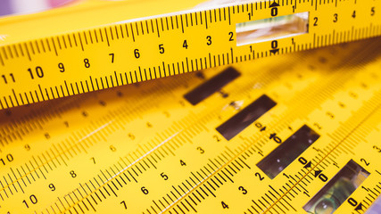 Carpenter essential instrument. Closeup of construction level rulers displayed in the tool store.