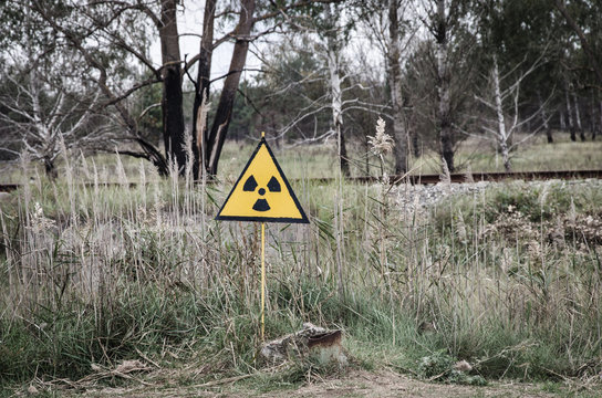Chernobyl Exclusion Zone. The accident at the Chernobyl nuclear power plant. The consequences of the accident. Yellow radiation sign. Dangerous territory. Infection with radiation. Polluted environmen