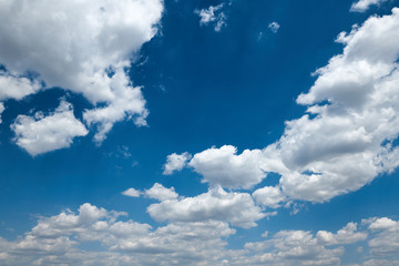 Bright beautiful blue sky with clouds for background or texture