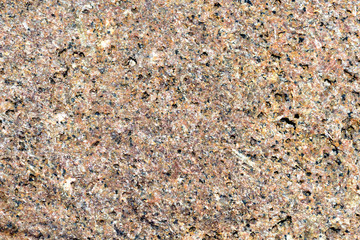 Texture of rocks on the seashore close-up. Natural stone background