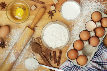 Food ingredients for baking: flour, eggs, milk, sugar	