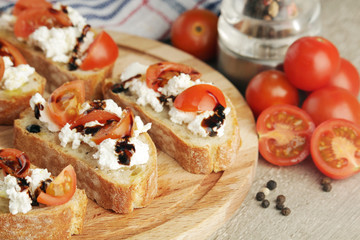 Sandwiches with tomatoes, homemade cheese, olive oil and balsamic sauce	