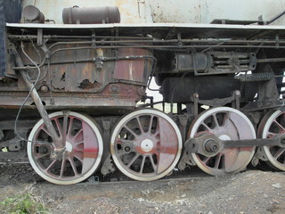 Fototapeta na wymiar Wheels of an old steam locomotive