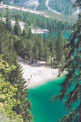 top view of the beach of lake in dolomites mountains