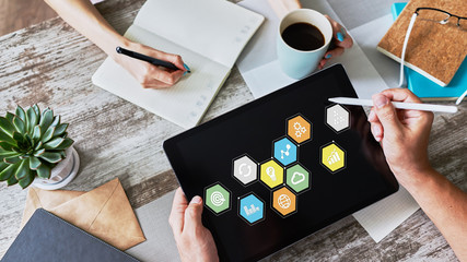 Colored application icons on device screen. Business, Internet and technology concept.