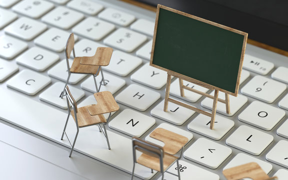 Blackboard and chairs on the keyboard of a latop, 3d rendering,conceptual image. e-training and e-learning concepts.