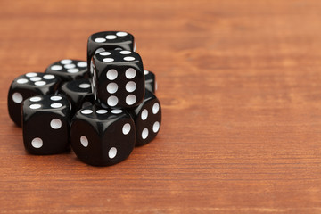 Dice on a wooden table. Concept for business risk.