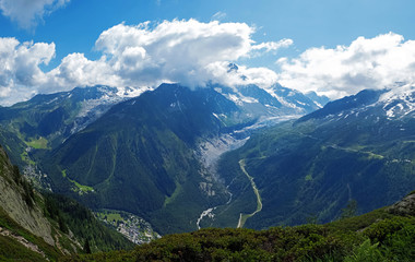 Naklejka na ściany i meble Beautiful panorama of French Alps with snowy peaks on summer