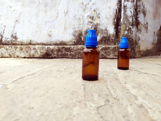brown glass medicine bottle put on the road
