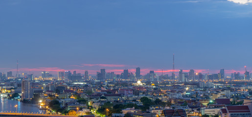 High rise office building The city centre of Bangkok. At dawn, the light from the sky is blue and orange.
