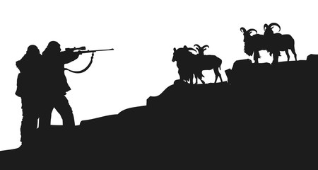 Rifle hunters pointing to a group of goats in a mountain. Silhouette.