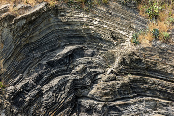 Close-up of a rocky cliff in Vernazza village, Cinque Terre National Park, UNESCO world heritage site. La Spezia province, Liguria, Italy, Europe