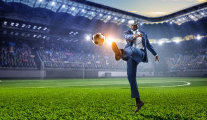 Fototapeta na wymiar Black businessman on virtual reality football match