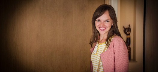 Portrait of young smiling woman at home.