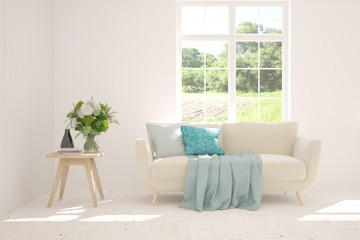 Stylish room in white color with sofa and summer landscape in window. Scandinavian interior design. 3D illustration