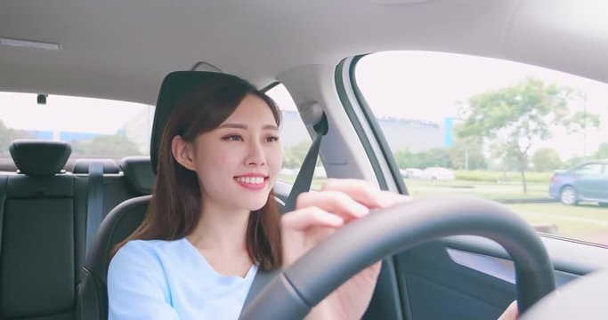 asian woman driving car