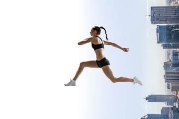 Abstract concept of running young sportswoman