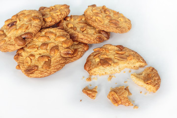 peanut cookie broken on white background.