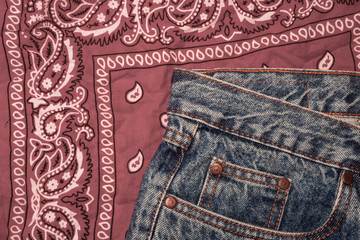 Classic jeans with five pockets. Paisley patterned bandana, classic red and white neckerchief,...