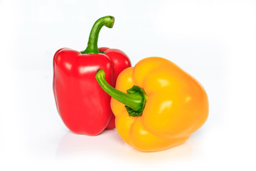 red and yellow bell pepper on white background.