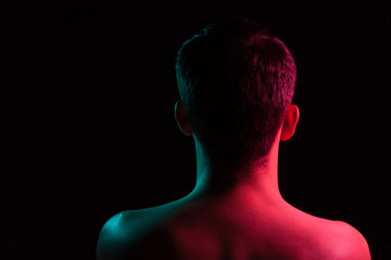 Close-up of the nape, back and shoulders of an short hair head of a man with stubble, naked without...