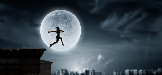 Jumping over precipice, challenge concept.