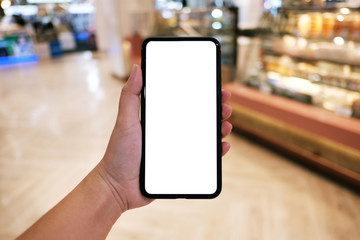 Women's hands holding cell telephone blank copy space screen. smart phone with technology concept.