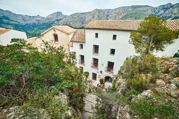 Fototapeta na wymiar Beautiful view on old buildings and mountains from a castle in Guadalest.