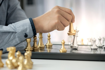 Businessman play with chess game. success management concept of business strategy and tactic...