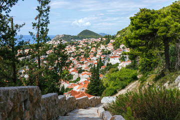 Beautiful townscape of Dubrovnik city in Croatia, panorama view. Old town and blue bay with boats