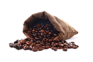 Coffee beans spilling from a jute sack or pouch