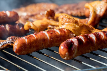 Unhealthy but tasty grilled sausages and meat