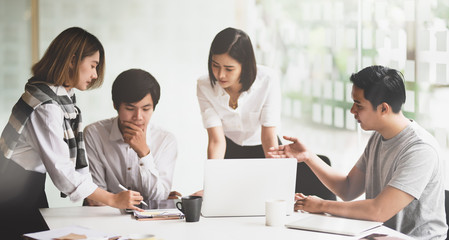 Motivated startup team consulting their startup plan
