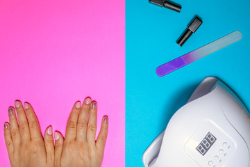 Female's hands after manicure procedure. Concept of nail polish art or shellac